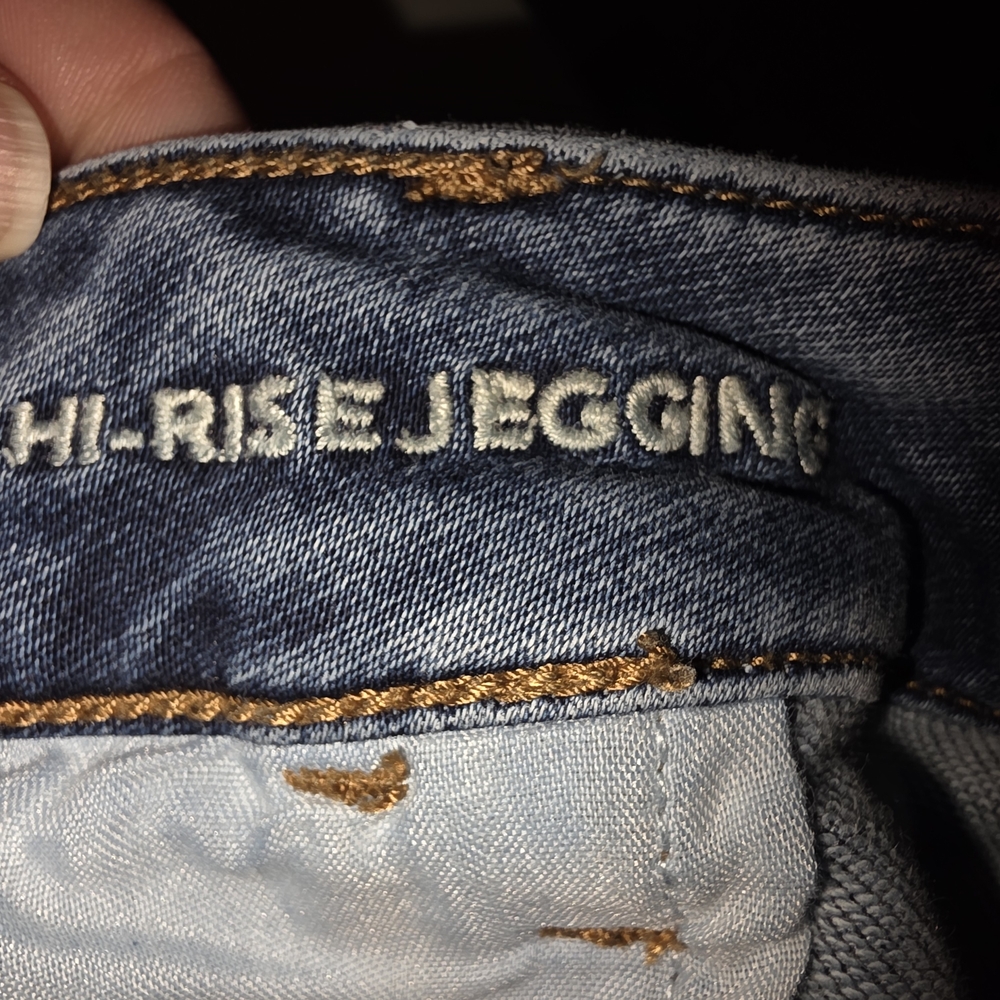American Eagle Outfitters dark blue denim jeggings with brown topstitching